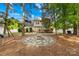 Spacious backyard features a stone fire pit area and a wood deck, perfect for outdoor entertaining at 8020 Sheckler Ln, Matthews, NC 28104