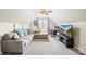 Living room featuring a large sofa, ceiling fan, and window for ample light at 8020 Sheckler Ln, Matthews, NC 28104