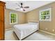 Cozy bedroom with carpet, two windows and ample space for relaxation and personalization at 8201 Lansford Rd, Charlotte, NC 28277