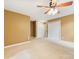 Bright bedroom with neutral carpet, large closets, and ceiling fan, offering a cozy and inviting retreat at 8201 Lansford Rd, Charlotte, NC 28277