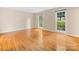 Spacious bedroom featuring hardwood floors and double windows at 8201 Lansford Rd, Charlotte, NC 28277