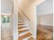 Inviting staircase leading to the upper level, enhancing the home's classic design and offering seamless transition to various spaces at 8201 Lansford Rd, Charlotte, NC 28277