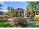Expansive backyard featuring a lush lawn, a patio, a water feature and an enclosed gazebo at 9219 Whispering Wind Dr, Charlotte, NC 28277
