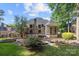 Beautiful backyard featuring a deck, screened porch, and well-maintained landscaping at 9219 Whispering Wind Dr, Charlotte, NC 28277