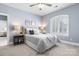 Bedroom with carpet, a Queen bed, and a shuttered window for natural light at 9219 Whispering Wind Dr, Charlotte, NC 28277