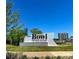 The Bowl at Ballantyne community sign on a sunny day with lush landscaping and modern buildings in the background at 9219 Whispering Wind Dr, Charlotte, NC 28277