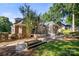 Spacious brick home with a screen porch, deck, and a stone fire pit at 9219 Whispering Wind Dr, Charlotte, NC 28277
