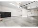 Spacious garage with ample storage and an epoxy floor at 9219 Whispering Wind Dr, Charlotte, NC 28277