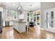 Spacious kitchen with a large island, stainless steel appliances, and hardwood floors at 9219 Whispering Wind Dr, Charlotte, NC 28277