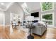 Living room with vaulted ceilings, abundant windows, and hardwood floors at 9219 Whispering Wind Dr, Charlotte, NC 28277