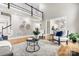 Open concept living room featuring a gray sofa, a coffee table, and hardwood floors at 9219 Whispering Wind Dr, Charlotte, NC 28277