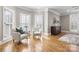 Cozy sitting area with plush armchairs, hardwood floors, and natural light at 9219 Whispering Wind Dr, Charlotte, NC 28277