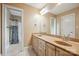 Bathroom with double vanity, framed mirrors, and a separate shower and toilet room at 100 Woodwinds Dr, Mount Holly, NC 28120