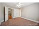 Comfortable bedroom with neutral carpet, double closets and direct access to another room at 100 Woodwinds Dr, Mount Holly, NC 28120