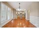 View of the kitchen area with an island, pendant lighting, and a view to the living room at 100 Woodwinds Dr, Mount Holly, NC 28120