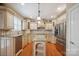 Elegant kitchen featuring custom cabinets, stainless steel appliances, and a functional island at 100 Woodwinds Dr, Mount Holly, NC 28120