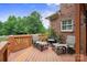 Relaxing outdoor deck area with comfortable seating, perfect for enjoying the serene surroundings at 100 Woodwinds Dr, Mount Holly, NC 28120