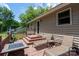 Inviting back deck featuring comfortable lounge chairs, a fire pit table, and steps leading to the yard at 103 Poplar Trl, Rockwell, NC 28138