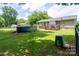Large backyard featuring a well-maintained lawn, above ground pool, and back deck with pergola at 103 Poplar Trl, Rockwell, NC 28138