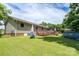 Spacious backyard featuring a well-maintained lawn, back deck, and above ground pool at 103 Poplar Trl, Rockwell, NC 28138