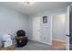 Bedroom featuring gray walls, plush gray carpet, and a white door and door frame at 103 Poplar Trl, Rockwell, NC 28138
