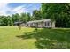 Well-maintained home with a spacious yard and inviting front porch, perfect for outdoor enjoyment at 103 Poplar Trl, Rockwell, NC 28138