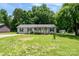 Charming one-story home with a spacious front yard and beautiful landscaping at 103 Poplar Trl, Rockwell, NC 28138
