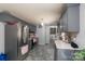 Spacious kitchen with stainless steel appliances, gray cabinets, and an adjacent laundry area for added convenience at 103 Poplar Trl, Rockwell, NC 28138