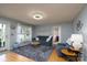 Comfortable living room featuring a plush sofa, inviting decor, and access to other areas of the home at 103 Poplar Trl, Rockwell, NC 28138
