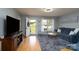 Inviting living room with stylish decor, hardwood floors, and a comfortable seating arrangement at 103 Poplar Trl, Rockwell, NC 28138