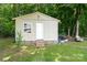 Exterior view of the storage shed featuring a window, door, and steps at 103 Poplar Trl, Rockwell, NC 28138
