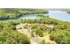 Beautiful aerial view of the lake and surrounding lush landscape and community amenities at 10300 Sweetleaf Pl, Charlotte, NC 28278