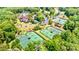 Aerial view of community amenities with tennis courts, clubhouse, playground, and ample parking at 10300 Sweetleaf Pl, Charlotte, NC 28278