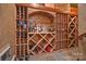 Home wine cellar featuring custom wood racking for storage at 10300 Sweetleaf Pl, Charlotte, NC 28278