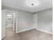A well-lit bedroom shows an open doorway to the bathroom at 1055 Laurel Ave, Lancaster, SC 29720