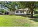 Charming home with a spacious yard, mature trees, and a detached garage at 1055 Laurel Ave, Lancaster, SC 29720