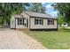 Inviting single-story home showcasing fresh paint, a new roof, and manicured landscaping at 1055 Laurel Ave, Lancaster, SC 29720