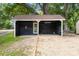 Detached garage structure featuring a single door and gravel driveway at 1055 Laurel Ave, Lancaster, SC 29720