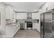 Bright kitchen with white cabinetry and stainless steel appliances at 1055 Laurel Ave, Lancaster, SC 29720