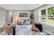Bright living room featuring modern decor, plush seating, and a view of the outdoors at 1055 Laurel Ave, Lancaster, SC 29720