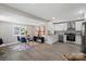 Open concept living space features dining area and white kitchen with stainless steel appliances at 1055 Laurel Ave, Lancaster, SC 29720