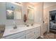 Bathroom features a double sink vanity with modern fixtures and linen storage cabinet at 107 Ingonish Dr, Gastonia, NC 28056