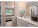 Bathroom features a double sink vanity, large soaking tub, and tile flooring at 107 Ingonish Dr, Gastonia, NC 28056