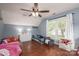 Bright bedroom with hardwood floors, a ceiling fan, and two twin beds, perfect for children at 107 Ingonish Dr, Gastonia, NC 28056