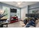 Bedroom features lots of sunlight with two windows, ceiling fan, and TV at 107 Ingonish Dr, Gastonia, NC 28056