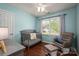 Charming Bedroom with a crib, rocking chair, and ample natural light at 107 Ingonish Dr, Gastonia, NC 28056