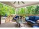 The covered deck has comfortable seating and provides a peaceful outdoor retreat at 107 Ingonish Dr, Gastonia, NC 28056