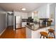 Modern kitchen features stainless steel appliances, granite countertops, and white cabinets at 107 Ingonish Dr, Gastonia, NC 28056