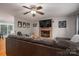 Cozy living room featuring a brick fireplace and comfortable seating area, perfect for Gathering gatherings at 107 Ingonish Dr, Gastonia, NC 28056