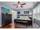 Cozy main bedroom with a large bed, ensuite bathroom, ceiling fan, and bright light at 107 Ingonish Dr, Gastonia, NC 28056